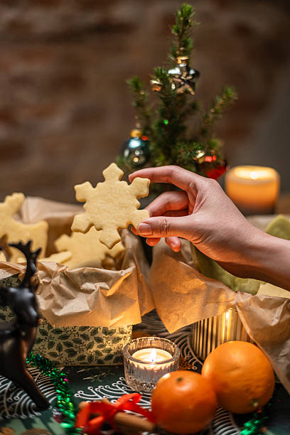 istock Delicious Christmas cookies displayed with festive decorations and warm candlelight 2207708453