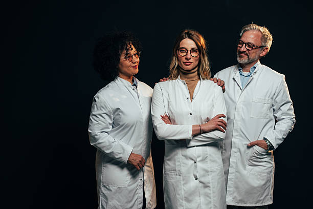 istock Confident medical team posing together on black background 2207709793