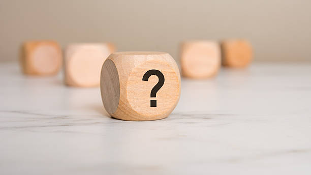 istock Wooden cube with a question mark symbolizing curiosity, mystery, and decision-making concepts. 2207710832