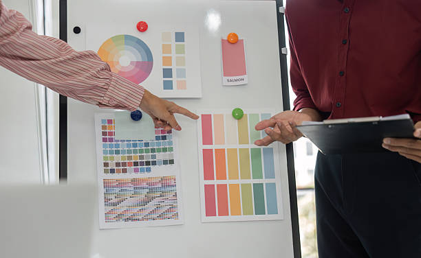 istock Color Selection and Collaboration. A creative team discussing color palettes for a design project. 2207721416