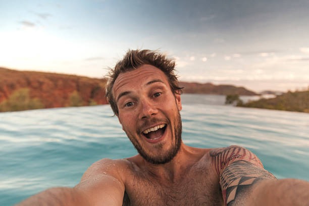 istock Enjoying a refreshing swim in Australia's Outback during sunset at a serene infinity pool 2207722341