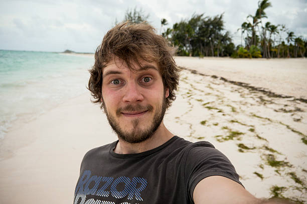 istock Smiling man enjoying a relaxing day on a serene Caribbean beach 2207723184