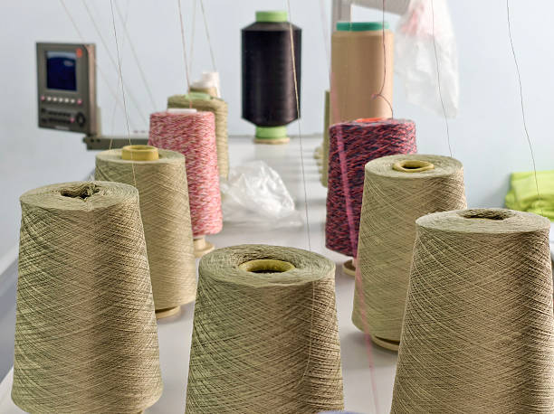 istock bobbins of cotton yarn on a knitting machine during the knitting process 2207723934