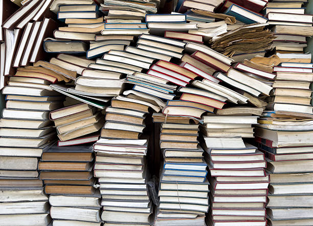 istock Old books stack background. Antique books on bookstore display 2207723959