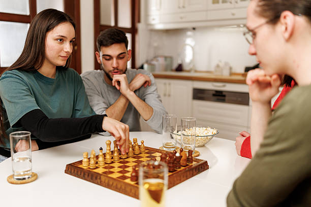 istock Friends playing chess at home 2207723966