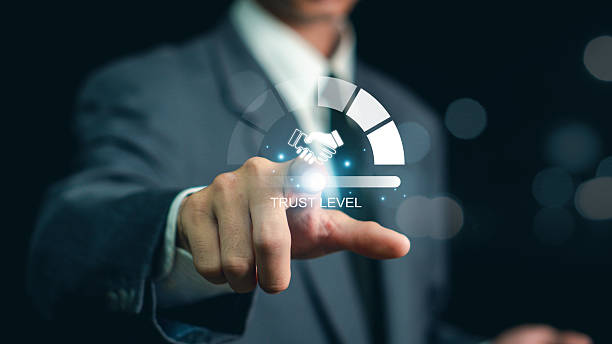 istock Trusted partner. Trustworthy collaboration, company or contract. Confidence to work together. Businessman turning knob to highest trust levels. Build trust in business and finance relationships. 2207727796