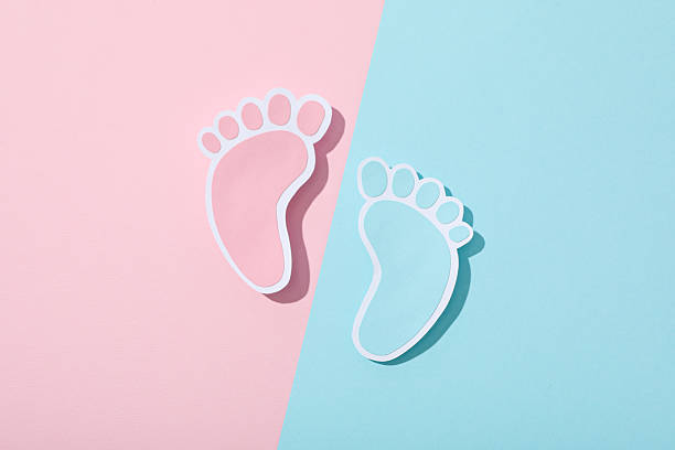 A gentle close-up image captures the sole of a baby's foot resting on a light fabric surface. The soft focus and warm tones highlight the delicate wrinkles and smooth texture of infant skin, symbolizing innocence, warmth, and tenderness.