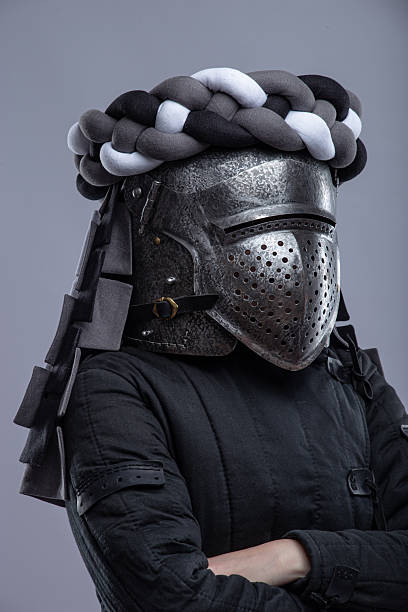 istock Person in Medieval Knight Helmet and Padded Jacket 2207728295