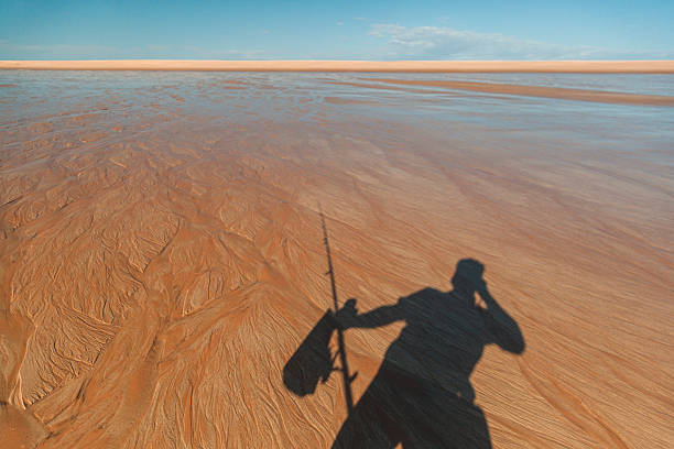 The people fishing on the beach