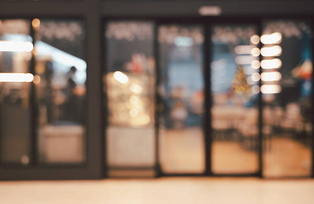 Abstract blurred image of cafe or restaurant with bokeh lights background at night