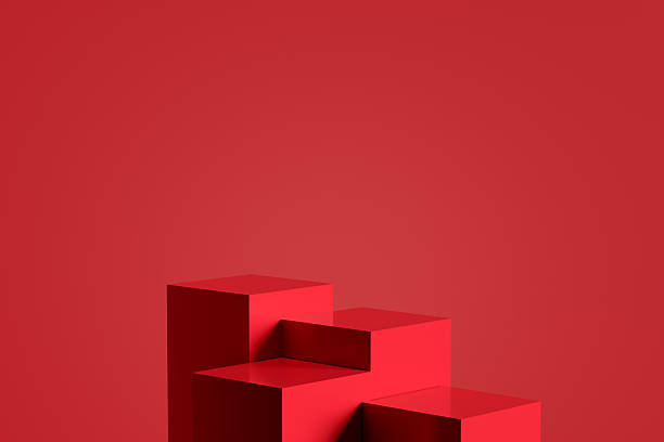 istock Red geometric podiums creating a staircase effect on red background 2207734219