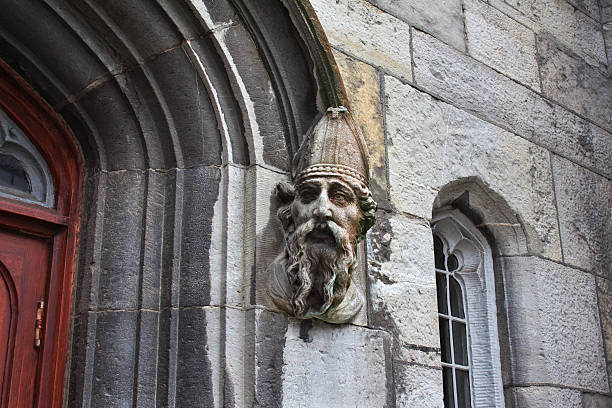 Weathered stone carving on a Cambridge door surround.