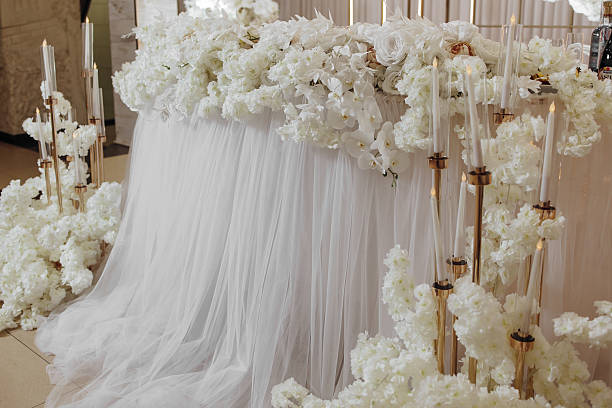 istock The table is decorated with white flowers and candles 2207735209