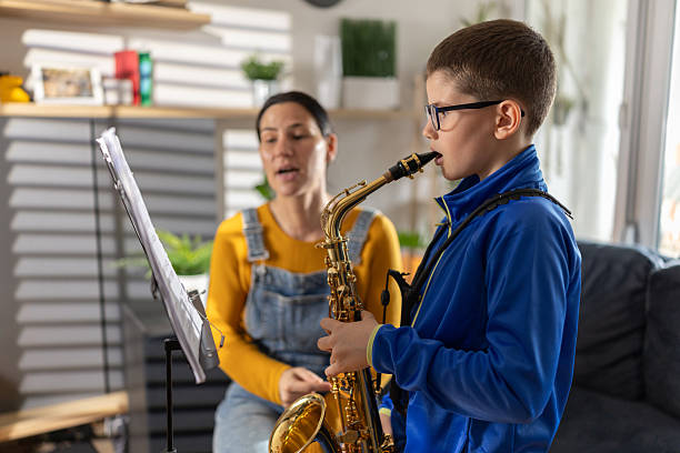 istock Saxophone play lesson with female teacher 2207736613