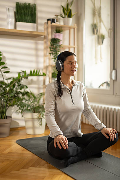 istock Woman meditating at home 2207736802