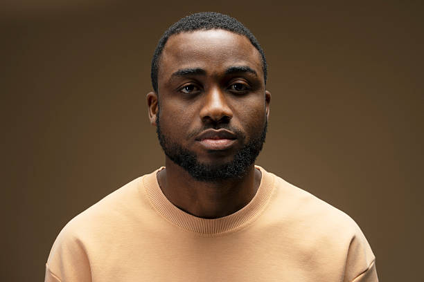 istock Serious young African American man showing confidence while posing in studio 2207737561