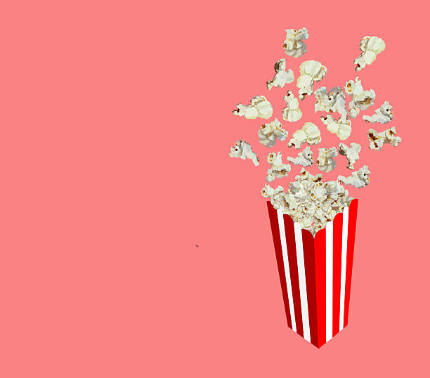 istock Red and white striped bucket and popcorn flying isolated on pink background 2207738911