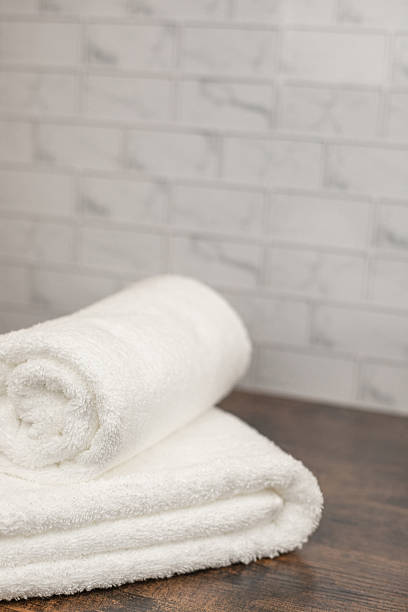 istock White terry towels. Folded white towel. Towel on the shelf 2207739713