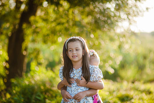 Little sisters playing and having fun ourdoors