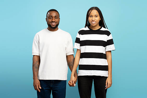 istock Happy couple holding hands, smiling and showing love and affection 2207741279