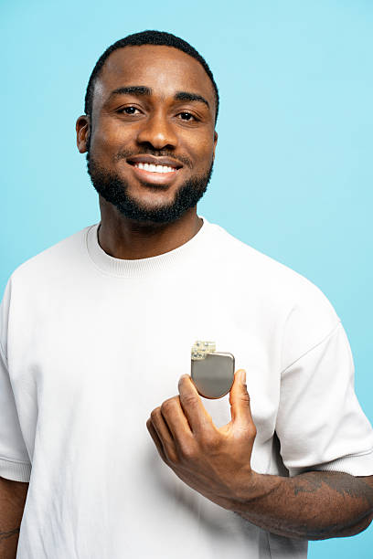 istock Smiling African American patient showing pacemaker device implanted near heart 2207741850