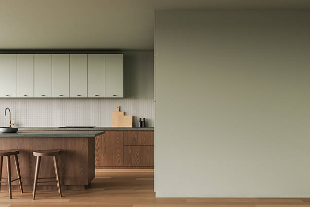 istock Minimalist kitchen interior with wooden and muted green elements, featuring an empty wall for poster or artwork mockup display. 3D Rendering 2207742616