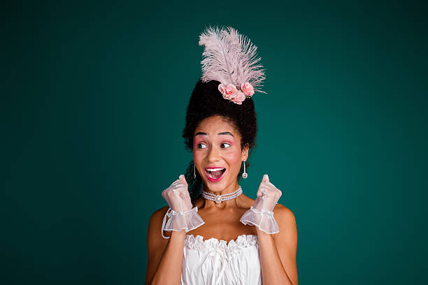 istock Elegant young woman in baroque costume with a playful expression 2207743337