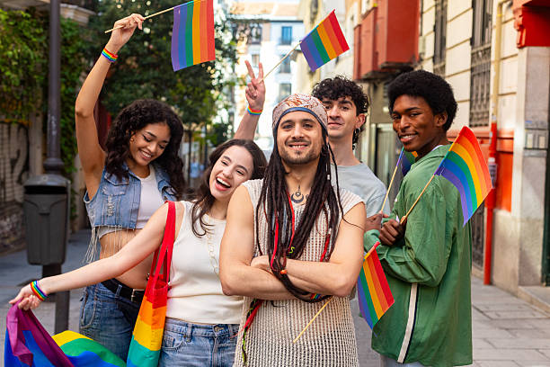 istock Young activists celebrating lgbtq plus pride with rainbow flags 2207743398