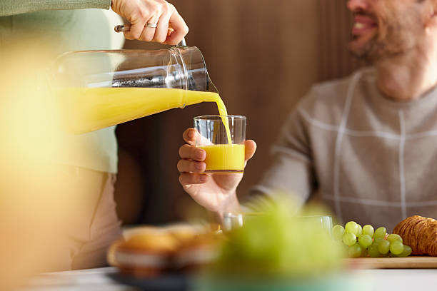 istock Pouring fresh orange juice! 2207744040