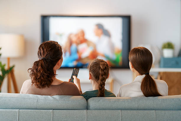 istock Mother and children watching  TV 2207746562