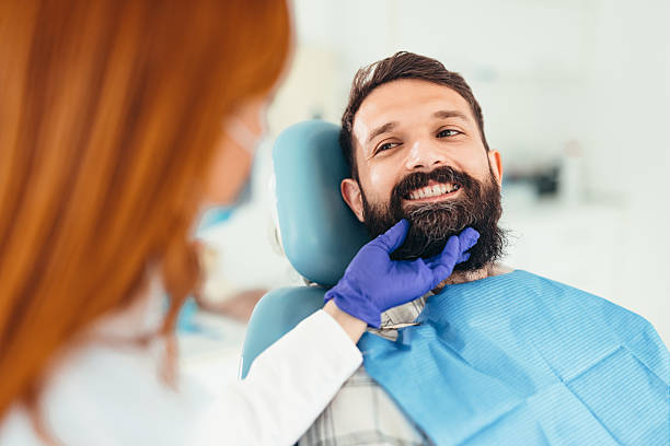 istock Dentist examining a smiling patient in a dental office 2207746721