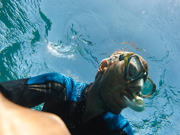 istock Diving adventure in clear blue waters with underwater exploration 2207747301
