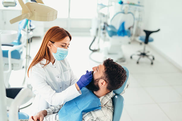 istock Dentist examining patient's teeth in dental office 2207747311