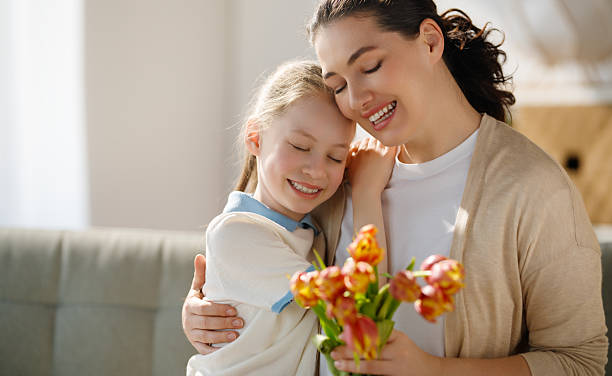 istock daughter and mom with flowers 2207748092