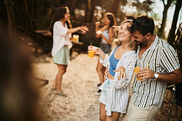 istock Cheerful couple dancing during spring party in nature. 2207749404