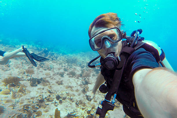 istock Exploring the underwater world while scuba diving in a tropical marine environment 2207750748