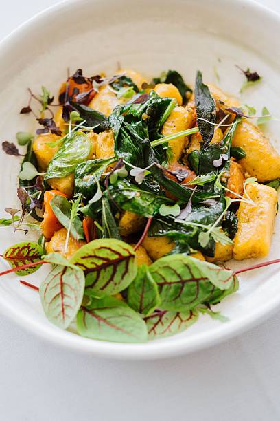 istock Gourmet gnocchi with fresh greens. 2207755567