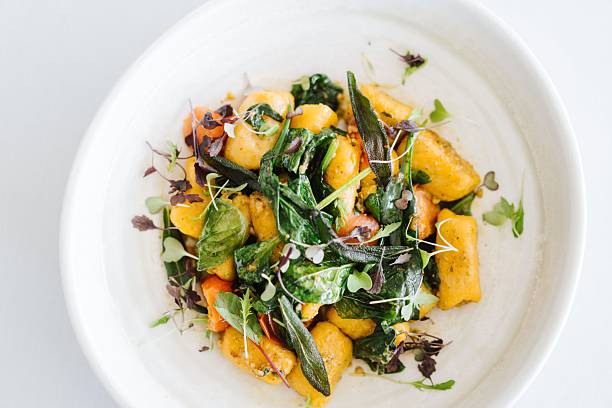 istock Gnocchi with Fresh Greens and Herbs 2207755625