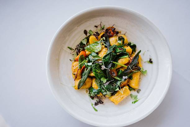 istock Gourmet gnocchi with greens and herbs. 2207755663