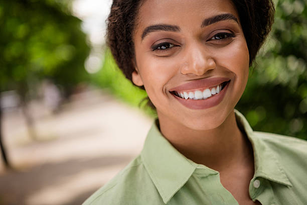 istock Radiant woman smiling outdoors in nature with a confident and joyful expression 2207758017
