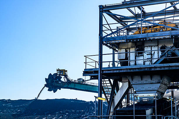 istock Digger and heaps of coal at the coal terminal 2207761707