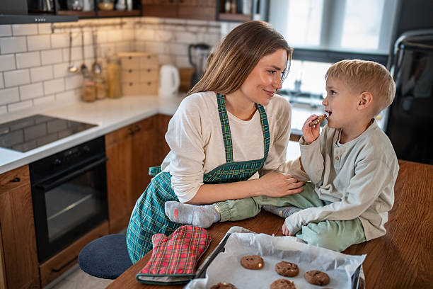 istock Mother and son sharing a sweet moment while baking cookies in the kitchen 2207763648