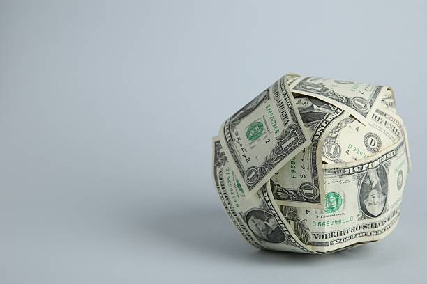 istock Ball made of dollars on light grey background. Space for text 2207764099