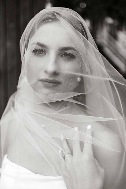 istock A woman is wearing a veil and has her hand on her hip 2207764351