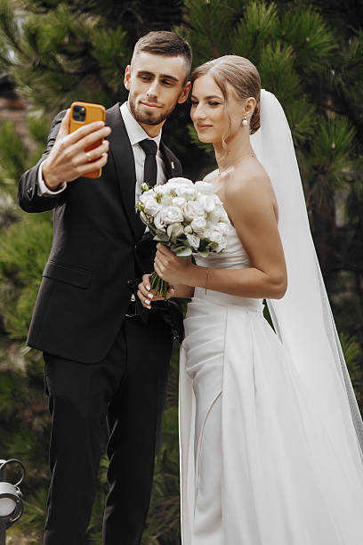 istock A man and a woman are posing for a picture 2207764385