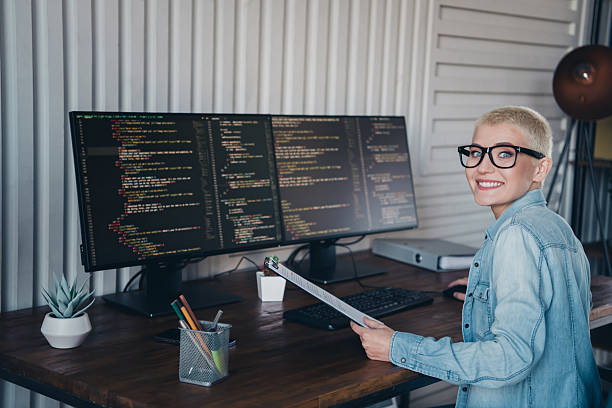 istock Young woman at home office coding in a professional environment showing enthusiasm and digital expertise 2207764617