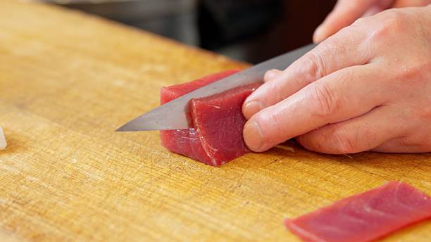 istock A Japanese chef cutting red tuna 2207765734
