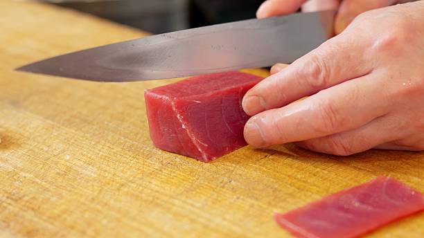 istock A Japanese chef cutting red tuna 2207765743