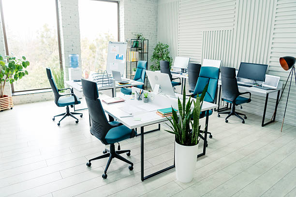 istock Modern coworking space with stylish office interior featuring desks, chairs, and natural lighting for collaborative work 2207766237