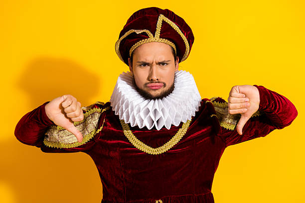 istock Young man in historical costume showing disapproval with yellow background 2207766457